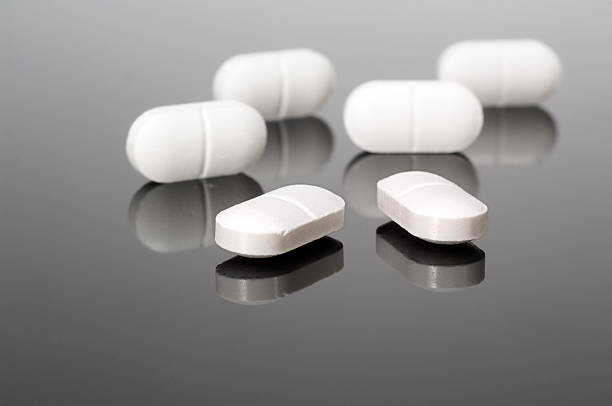 istock Close-up of white painkiller pills 176071864