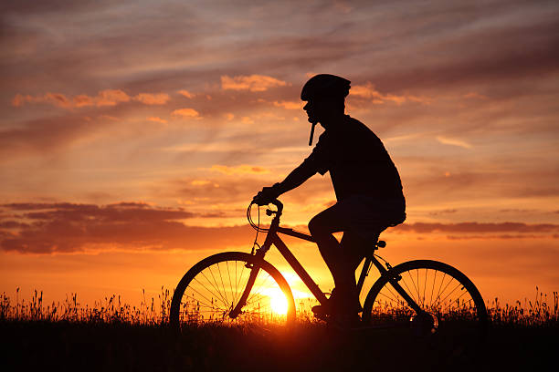 istock Silhouette of Bicyclist by Sunset 176071933