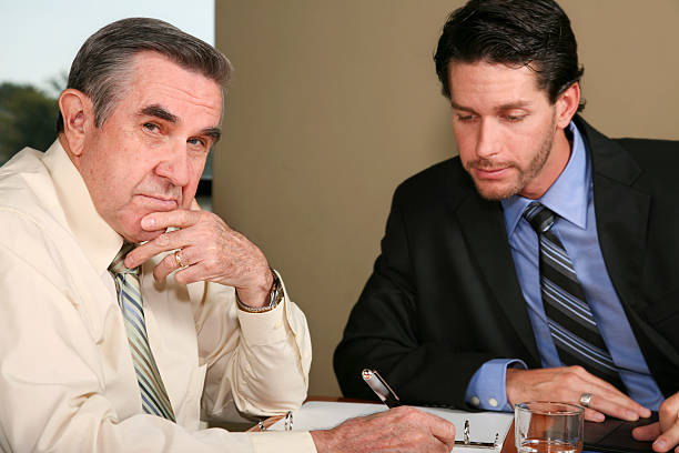istock Senior Adult Man Worried About Signing Documents 176072676