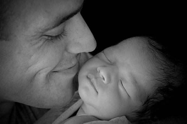 istock Father and Newborn Baby 176073219
