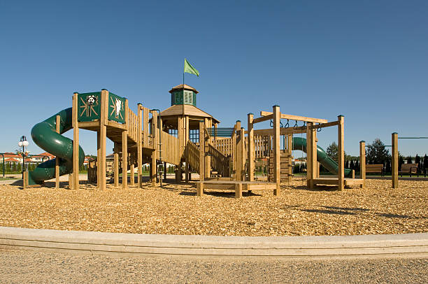 Wooden playground in a sunny day. Located in suburban communityFEW SIMILAR RICTURES