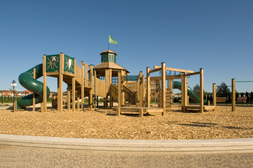 Wooden playground in a sunny day. Located in suburban communityFEW SIMILAR RICTURES