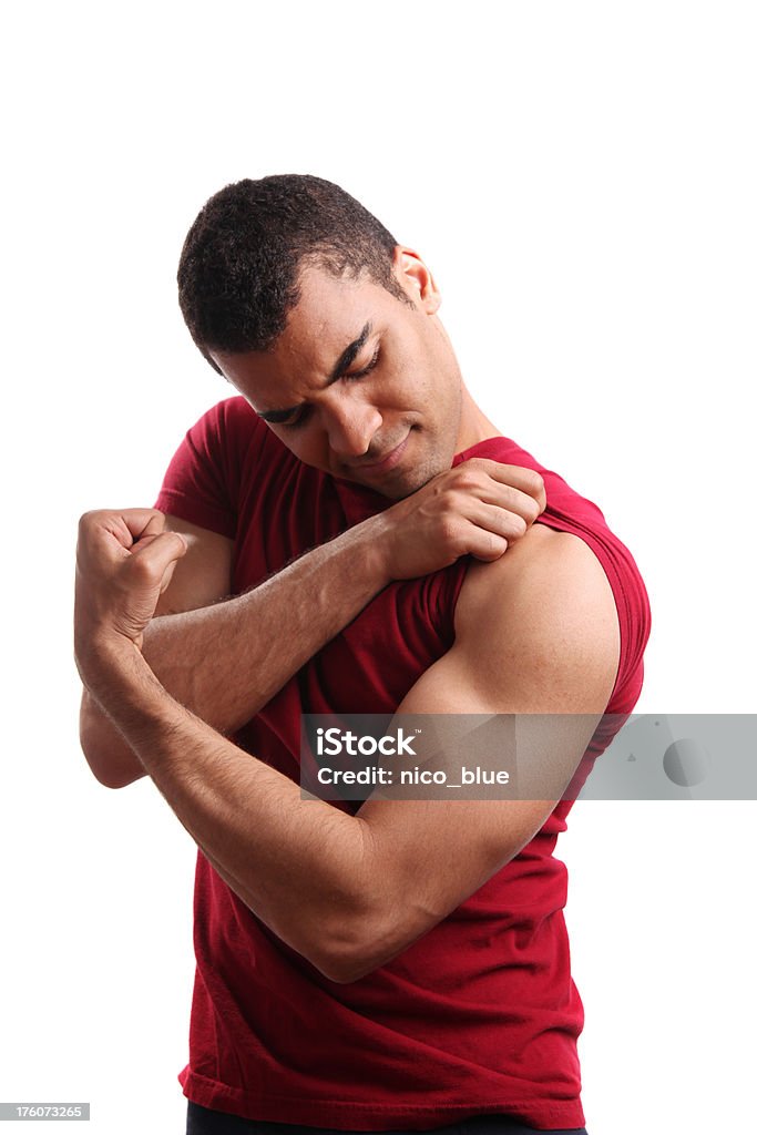 Forte jovem rapaz flexionando seu bíceps - Foto de stock de Flexionar Músculos royalty-free