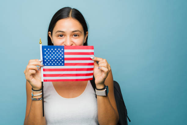 istock Young woman student studying English using a US flag 1760734075