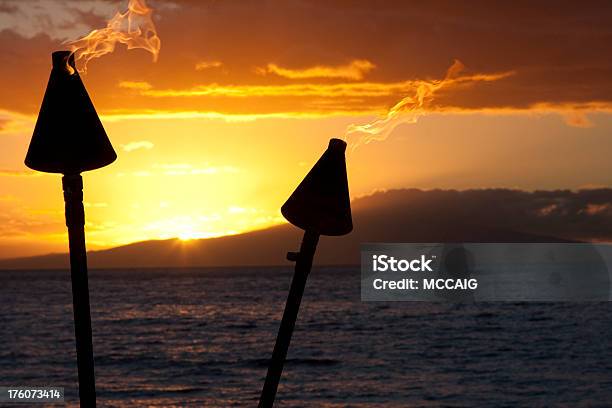 Island Sunset Stock Photo - Download Image Now - Beach, Flame, Flaming Torch