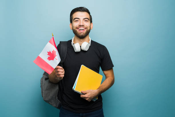 istock Excited young man learning English holding a Canada flag 1760735176
