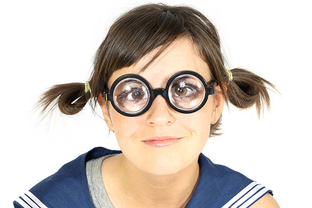funny girl in thick lens glasses stock photo