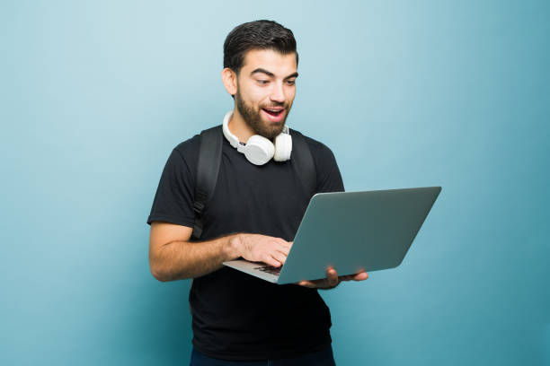 istock Attractive hispanic man studying college online 1760741140