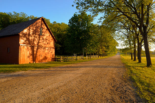 istock barn and road, southern Minnesota 176074439