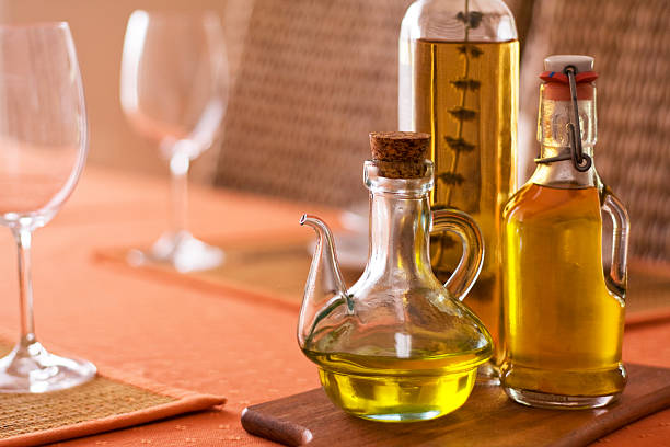 istock Olive oil bottles on served table 176074494