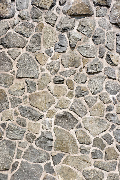 Subject: Background texture of a mortared gray and brown stone wall