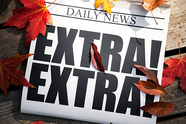istock EXTRA! Newspaper on Deck with Autumn Leaves 176074739
