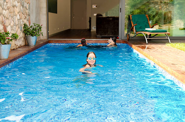 istock Swimming pool communicating with the living room 176075359