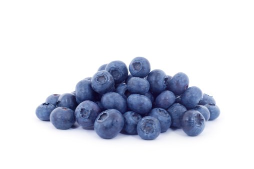 A very large pile of blueberries isolated on a white background with a shadow.Blueberries are deep blue berries mainly native to North America. They are around 5-16mm in diameter and are grown on bushes.Similar: