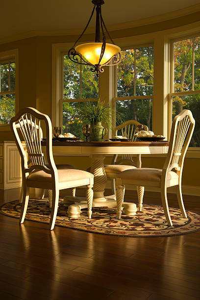 istock Late afternoon sun warms a kitchen table and chairs. 176075686