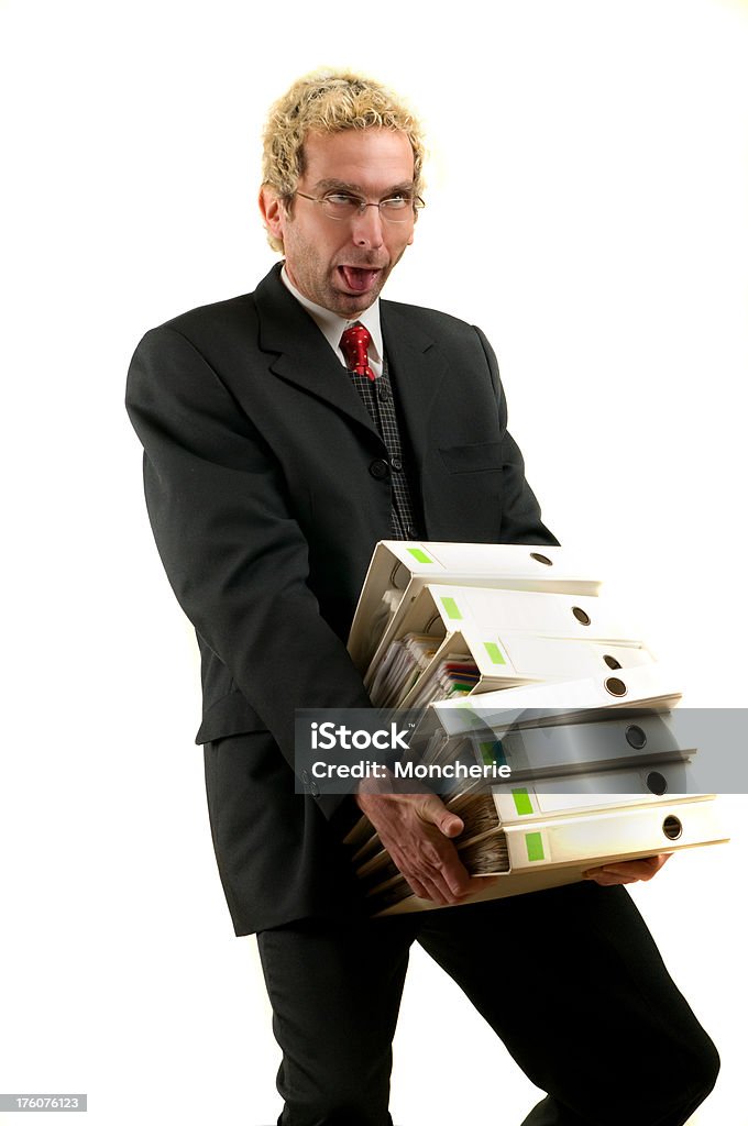 Too Heavy ! The businessman with a stack of files. Adult Stock Photo