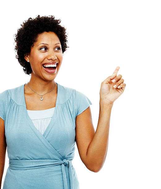 istock Mid adult woman pointing towards copyspace 176076165