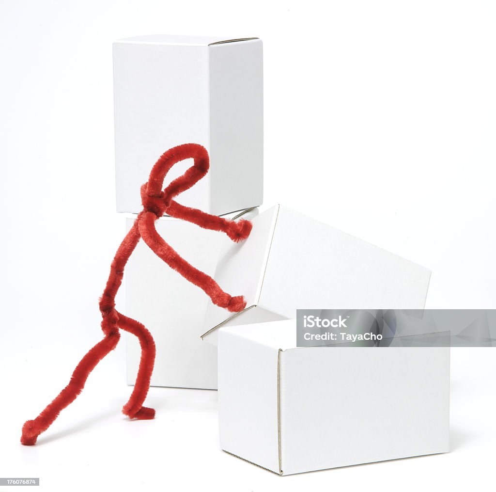 Red figure moving white box Red pipe cleaner figure stacking white cartons Cut Out Stock Photo