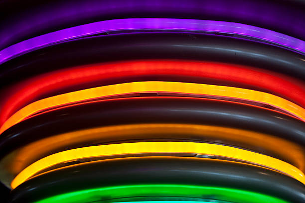 arcobaleno di tubi al neon decorativi, illuminazione per le feste - neon light rainbow bright gay pride foto e immagini stock