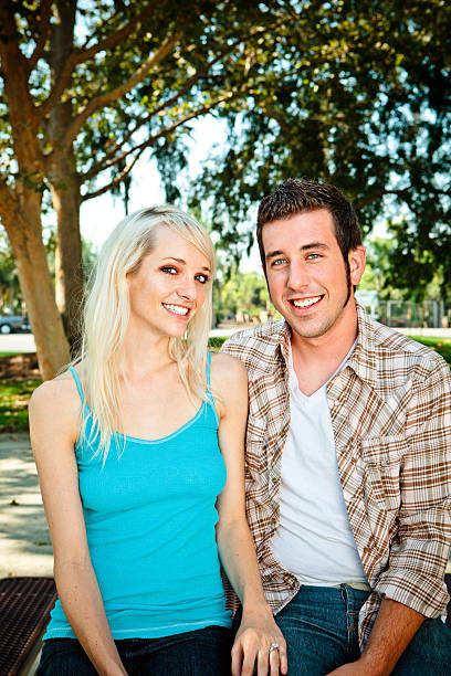 istock young love couple smiling at camera 176077603