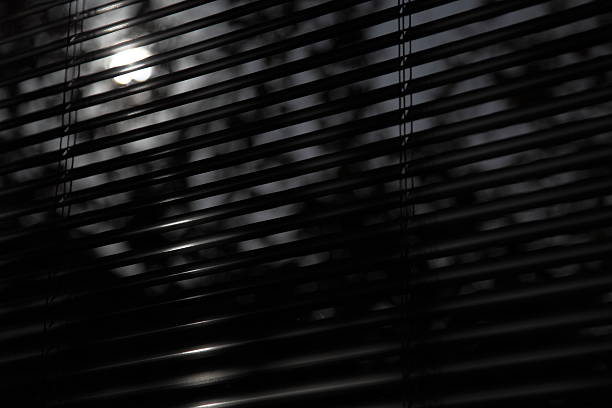 istock Dark stribed venetian blind in bedroom background at moonlight 176077668