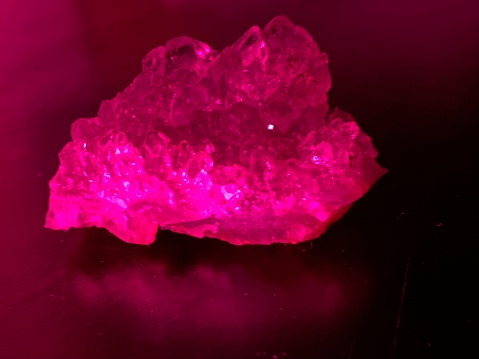 A rare pink crystal shining in the light