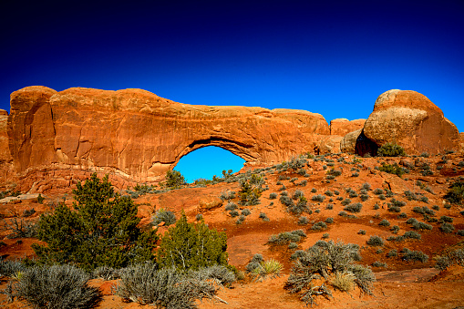 Color Photograph of North Window arch formation, Arched National Park. Moab UT