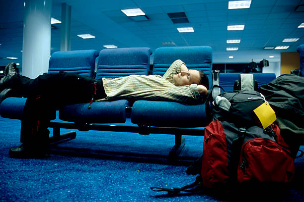 istock waiting young man at airport 176078005