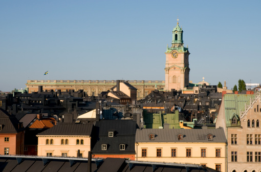 Beautiful light from sunset over Stockholm city center at springtime. Lot of boats docked in harbor