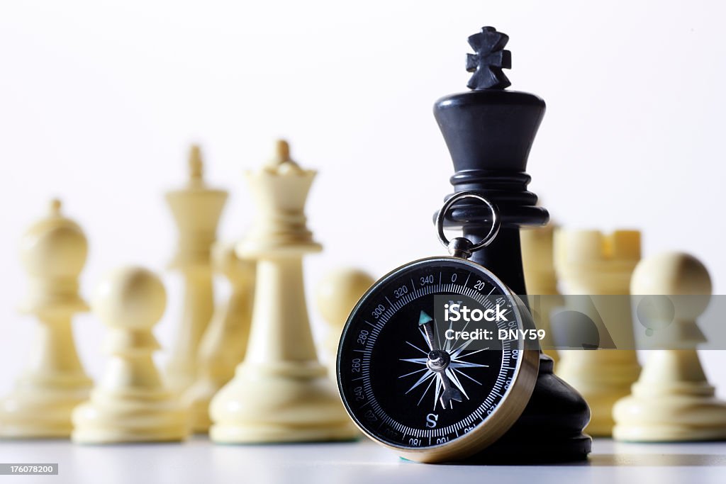 Compass Leaning Against Chess Piece With Other Chess Pieces In Background  Stock Photo - Download Image Now - iStock