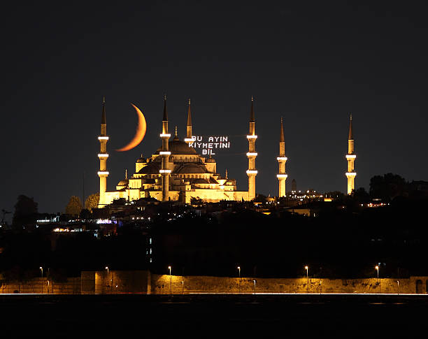 Blue mosque in Ramadan "Sultanahmet mosque and crescent during Ramadan in Istanbul/Turkey.  . The Mosque  is illuminated specially for Ramadan - mahya - it says "" Appreciate the worth of this month ( Ramadan )"" in Turkish." allah photos stock pictures, royalty-free photos & images