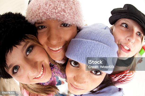 Four Teenage Girls In Winter Hats And Scarfs Stock Photo - Download Image Now - 16-17 Years, Adolescence, Adult