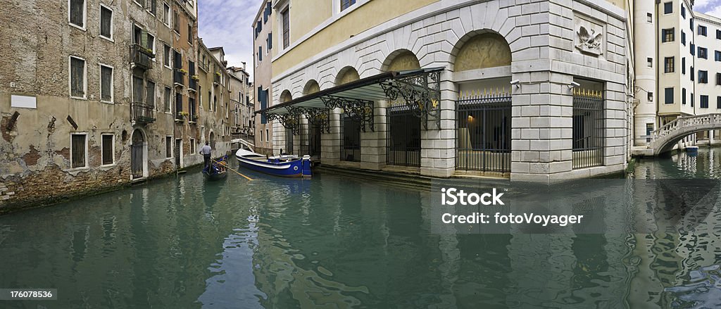 Venice Teatro La Fenice gondola panorama Italy.jpg "The turquoise waters of typical Venetian canals reflecting the villas, footbridges and boats around the famous Teatro la Fenice, the 18th Century opera house in the San Marco quarter of Venice, Italy as a gondolier rows by. ProPhoto RGB color profile for maximum color fidelity and gamut." La Fenice et des Artistes Stock Photo