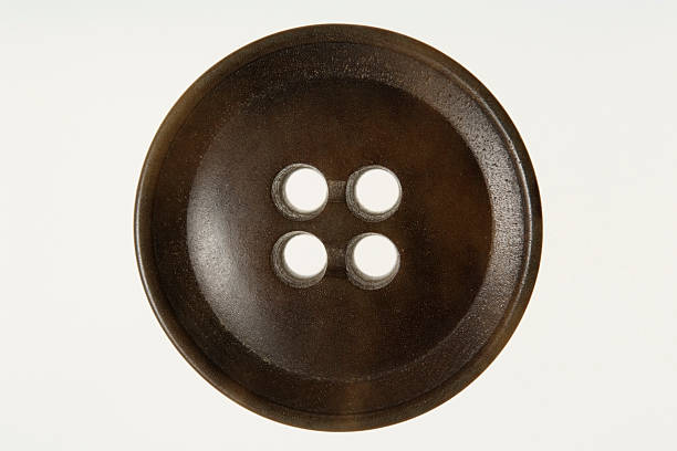 istock Isolated shot of old wooden button on white background 176079292