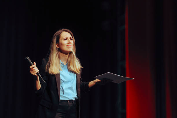 istock Confused Puzzled Woman Taking Questions on a Public Stage 1760806214