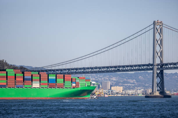 Oakland bound container ship heading under the San Francisco Bay Bridge for the Port of Oakland.