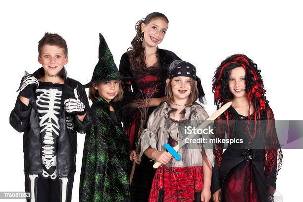 Studio Portrait Of Five Children Dressed In Costumes For Halloween Stock Photo - Download Image Now
