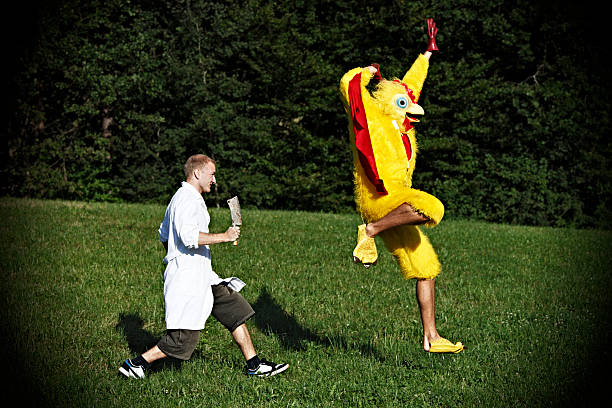 chicken flying away from butcher - tavuk kostümü stok fotoğraflar ve resimler