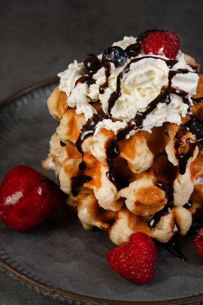 istock Belgian waffles with whipped cream and berries 1760815714