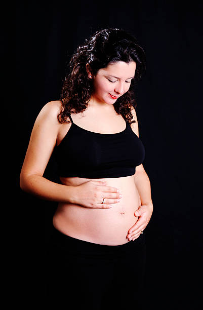 Pregnancy "5 months pregnant young woman.For more of my similar images, please follow the banner link below:" 3 months pregnant belly stock pictures, royalty-free photos & images
