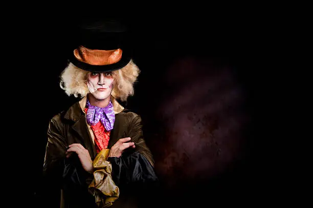 Male in Mad Hatter costume stands with arms folded...i created the costume myself.