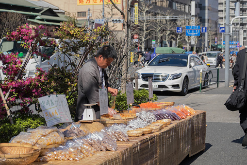 tokyo,japan - march 27, 2015 : vendor and tourist at the morning in tsukiji fish market in tokyo.japan