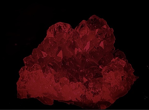 A red Crystal Shines in the Darkness