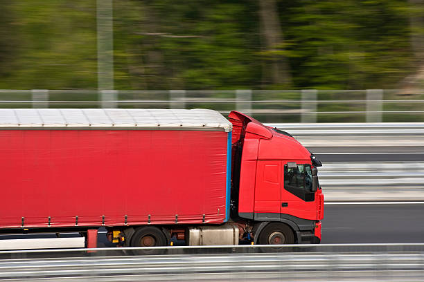 istock Red truck on a highway 176083304