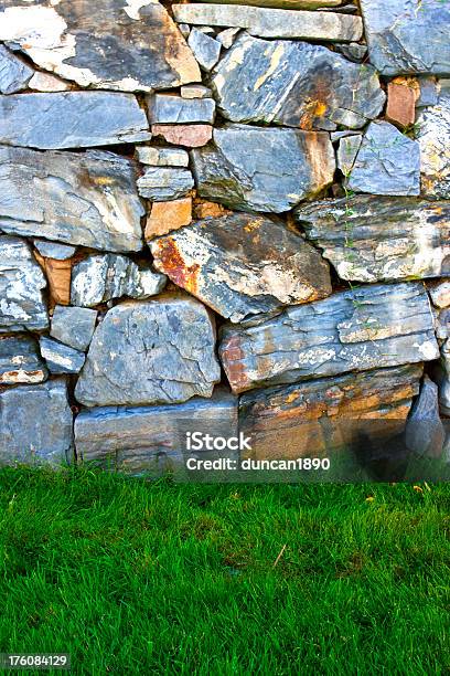 Rough Dry Stone Wall And Green Grass Stock Photo - Download Image Now - Agricultural Field, Architecture, Backgrounds