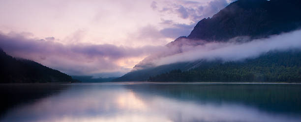 istock morning mist at lake plansee 176084166