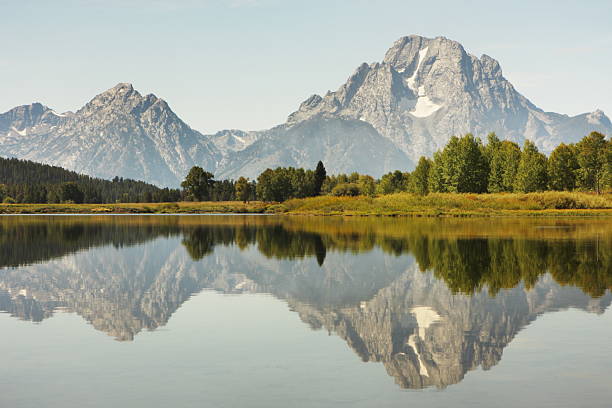 Snake River Reflection Grand Teton "Grand Teton Mountains reflected in the Snake River shortly before sunset.  Grand Teton National Park, Jackson Hole, Wyoming, 2009." snake river valley grand teton national park stock pictures, royalty-free photos & images