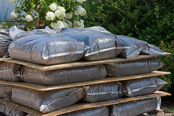 Stack of Peat Potting Soil in Plastic Bags A stack of peat potting soil in plastic bags. Peat stock pictures, royalty-free photos & images