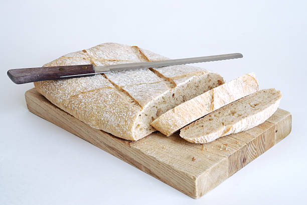 sliced loaf of ciabatta stock photo