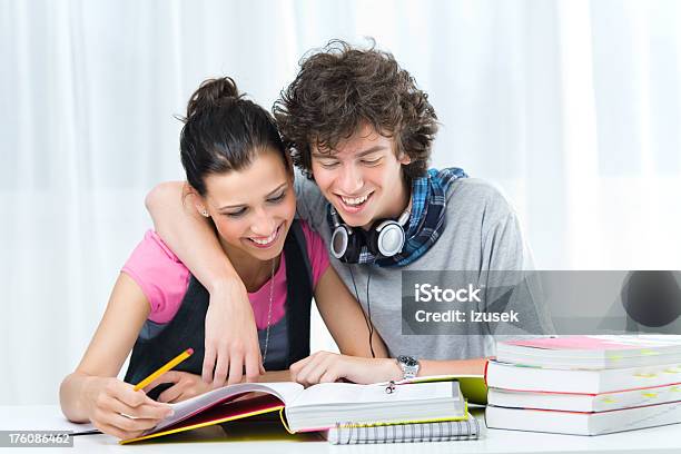 Two Teens Studying Together Laughing Stock Photo - Download Image Now - 16-17 Years, 18-19 Years, Adolescence